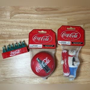 Coca Cola bundle vintage memorabilia. Two squishees and cola bottle magnet.